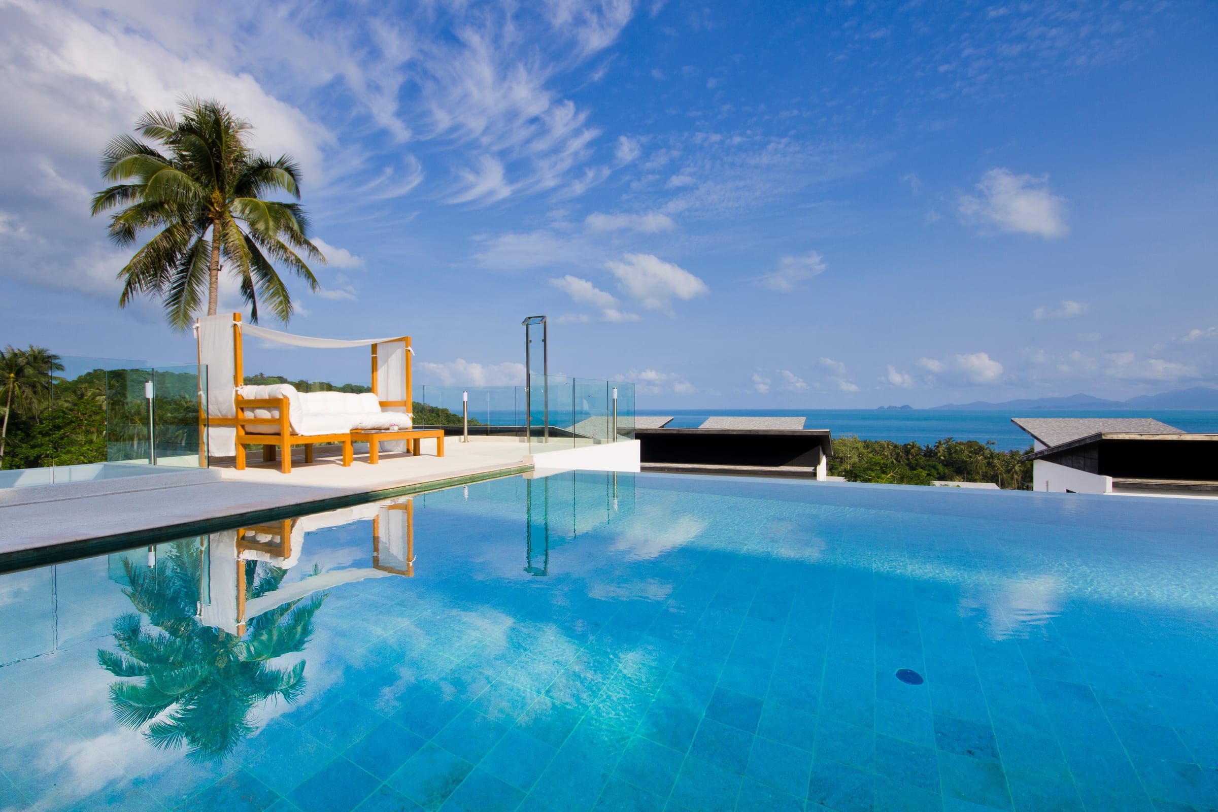 Infinity pool and daybed above the Gulf of Thailand