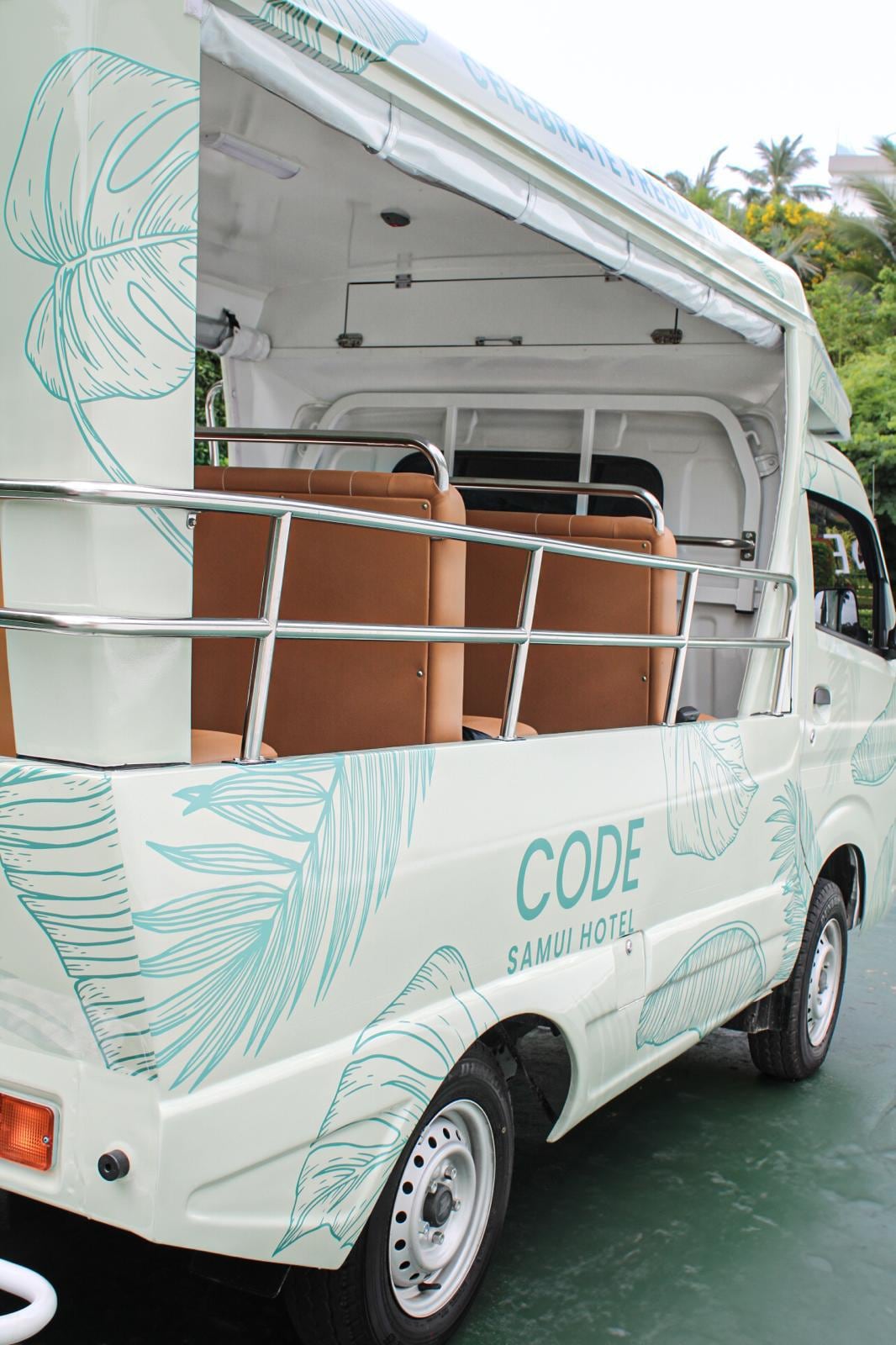 The CODE Tuk Tuk, open-sided with tan leather bench seats