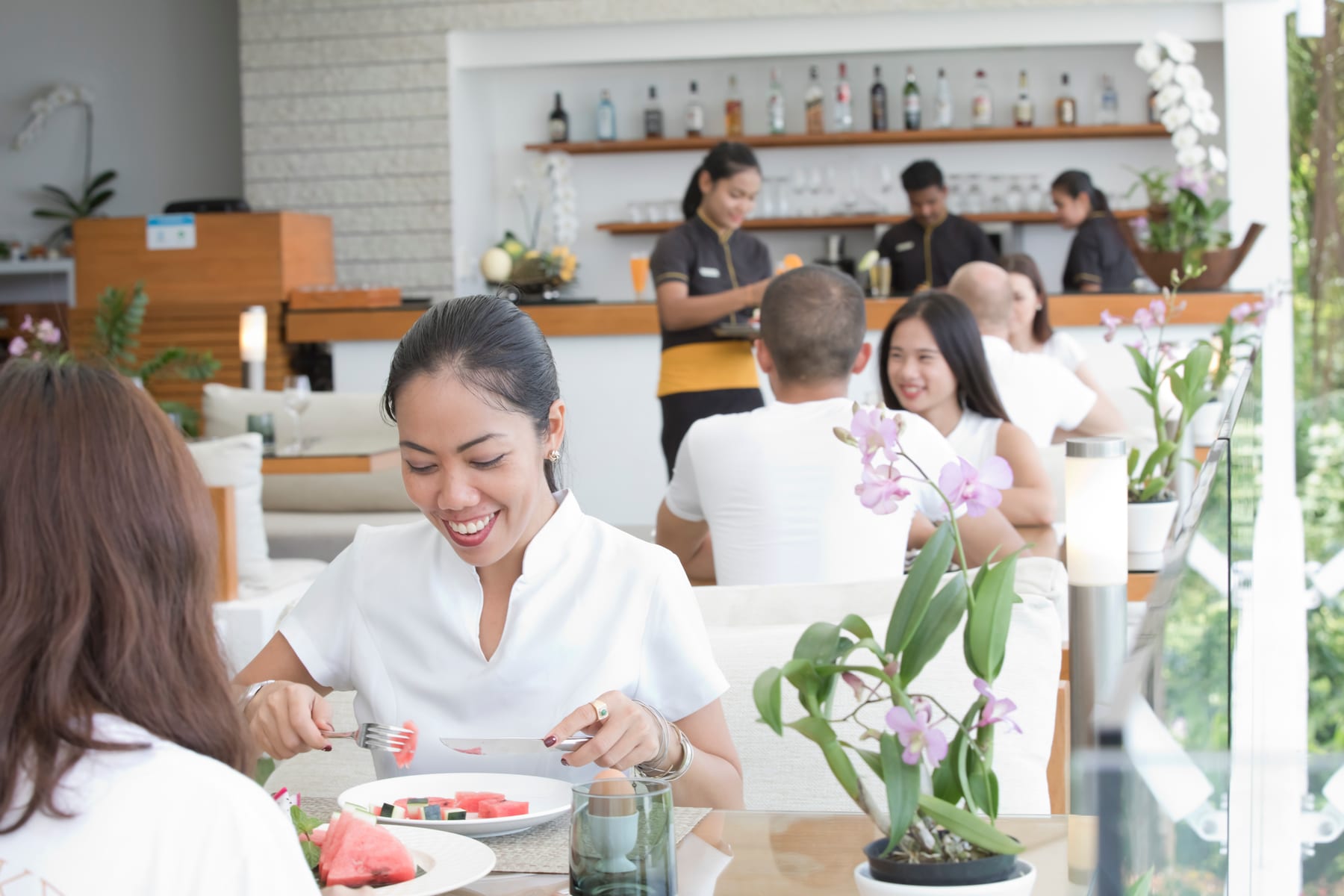 Guests dining on the terrace at CODE Café