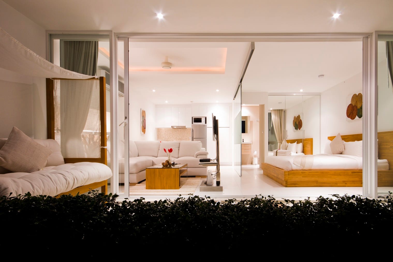 Penthouse suite opening onto its terrace at dusk